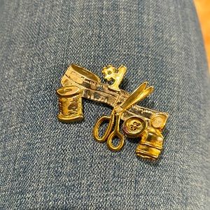 Silver and gold metal sewing brooch or pin. Vintage item.